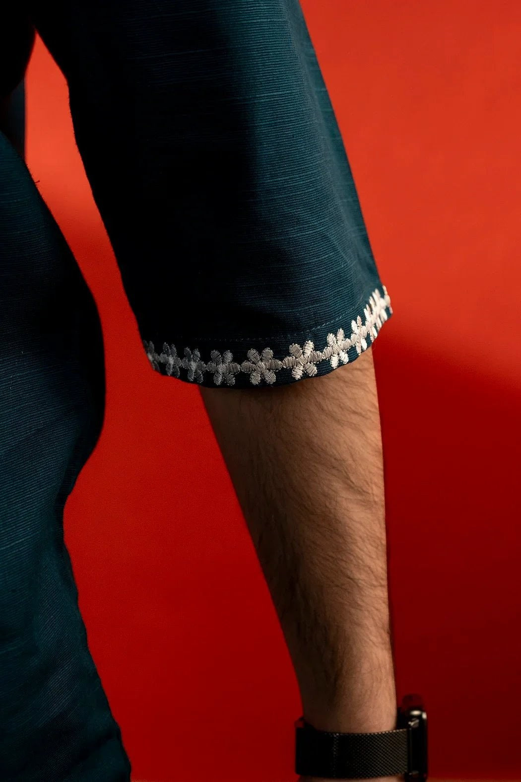 Koti Apparels sea green unisex cotton shirt with quarter sleeves and delicate white floral embroidery on the cuff.